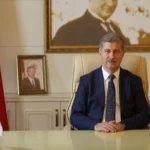 Ağrı İbrahim Çeçen Üniversitesi Kurumsal Akreditasyon logosu ve binası