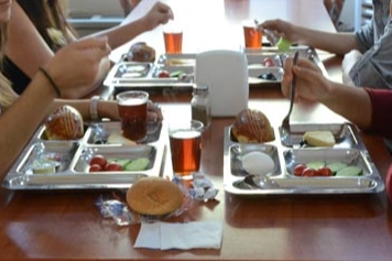 Kamu Denetçiliği Kurumu (KDK) logosu ve üniversite kampüsü görseli